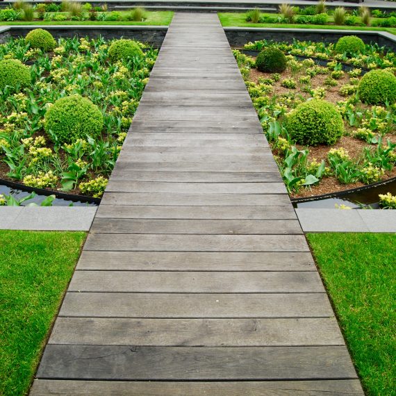 Scorched oak boardwalk over sunken garden designed by Carolyn Grohmann
