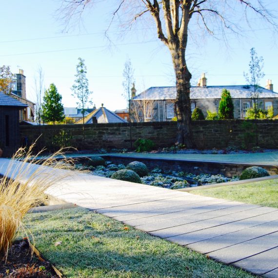 Frosted sunken garden and scorched oak boardwalk, designed by Carolyn Grohmann