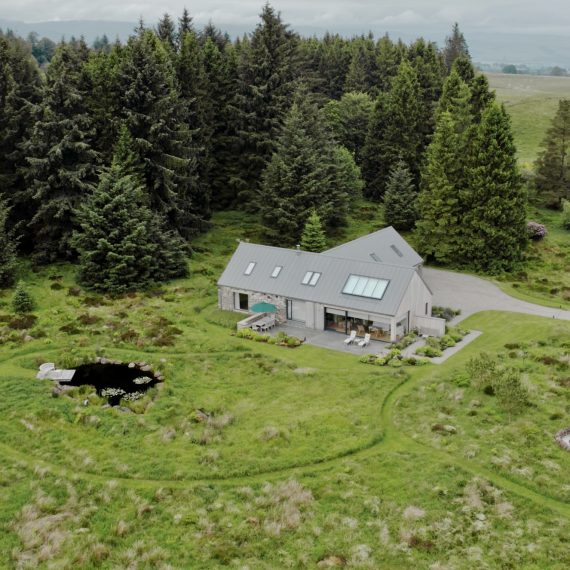 Drone shot of house, pond and 'Sheep Pen'
