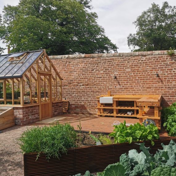 Cedar greenhouse and Scottish larch potting bench