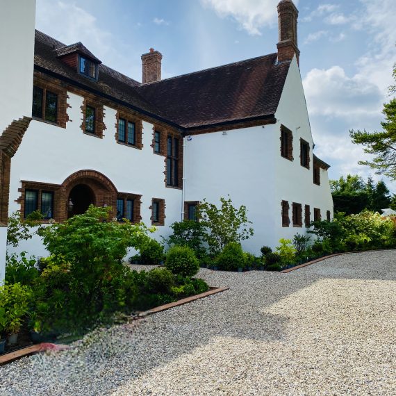 Arts and Crafts house with planted borders