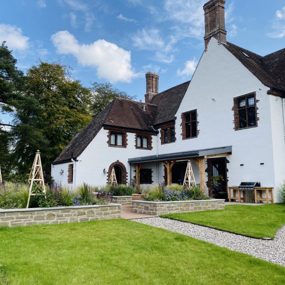 Arts and Crafts house with raised bed courtyard patio