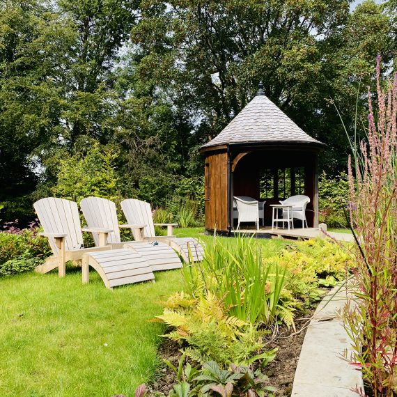 Victorian summerhouse and adirondack chairs