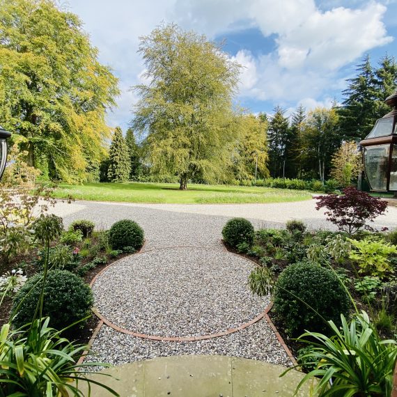 Front of house driveway with large borders