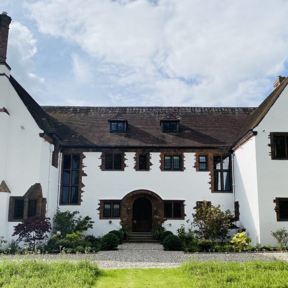 Arts and Crafts house with recently planted borders