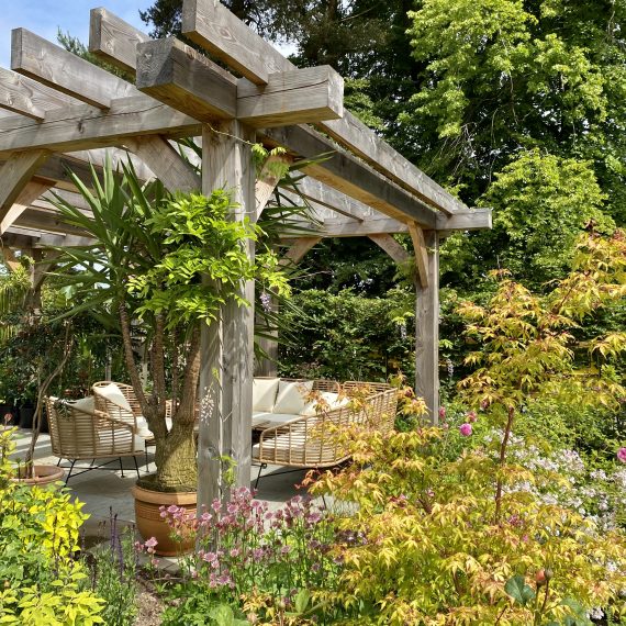 Scottish larch pergola with seating area