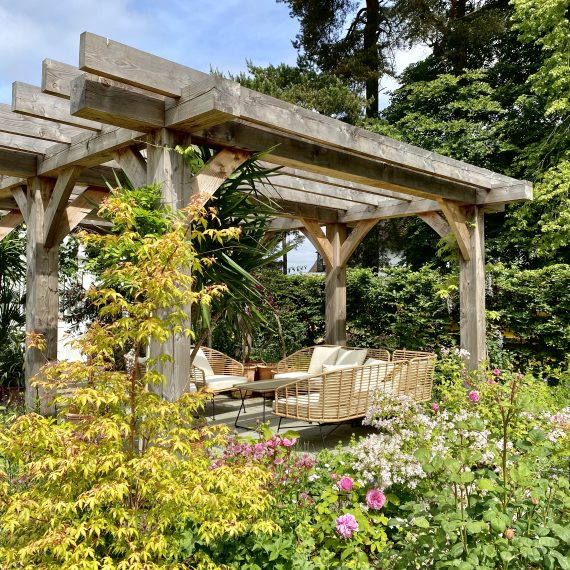 Scottish larch pergola with seating area