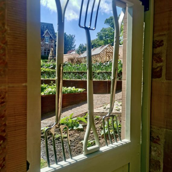 Garden fork gate leading to kitchen garden