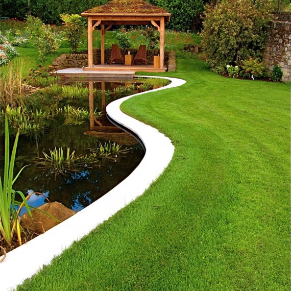 Curving stone edges of the figure of eight pond. Designed by Carolyn Grohmann
