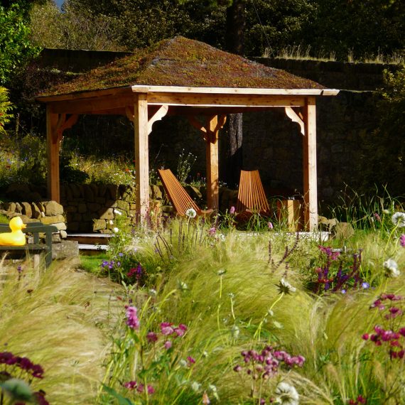 Scottish larch arbour. Garden design by Carolyn Grohmann