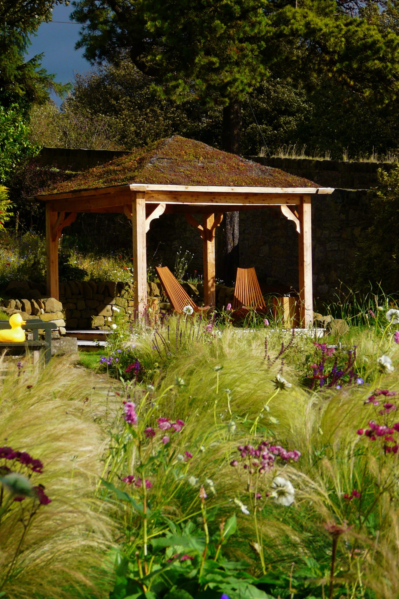 Scottish larch arbour. Garden design by Carolyn Grohmann
