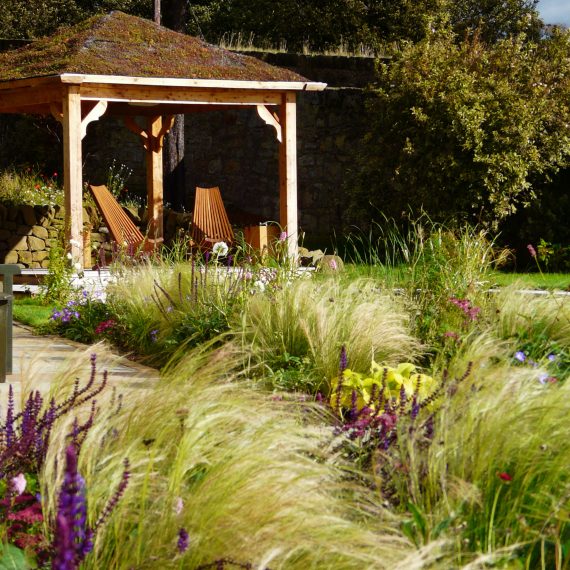 Scottish larch arbour. Garden design by Carolyn Grohmann