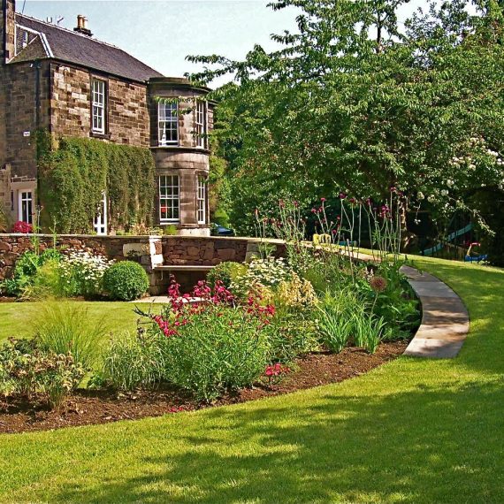 Serpentine wall with circular lawns, designed by Carolyn Grohmann