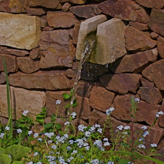 Water feature built into Serpentine wall, designed by Carolyn Grohmann