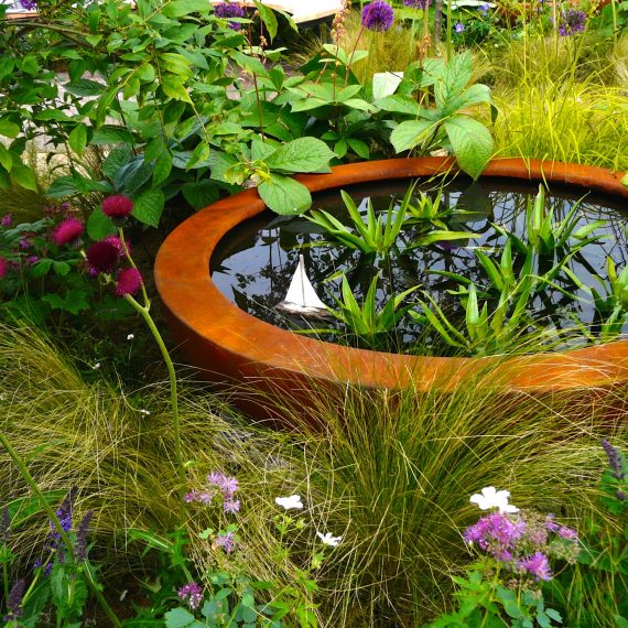Gold Medal winner designed by Carolyn Grohmann, 2014 Gardening Scotland, built for the Freedom From Fistula Foundation Charity, Urbis lily bowl, plants supplied by Binny Plants