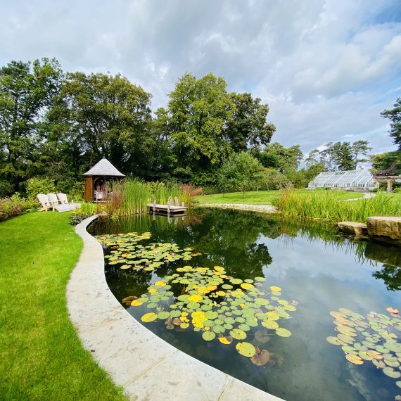 Swimming pond with summerhouse