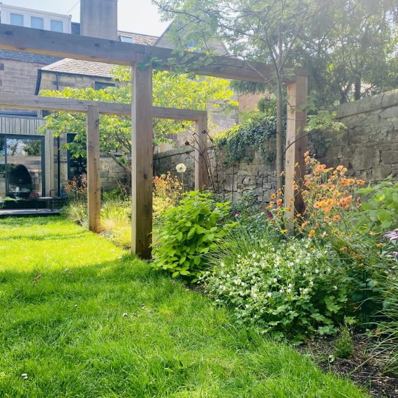 Scottish larch pergola and herbaceous planting