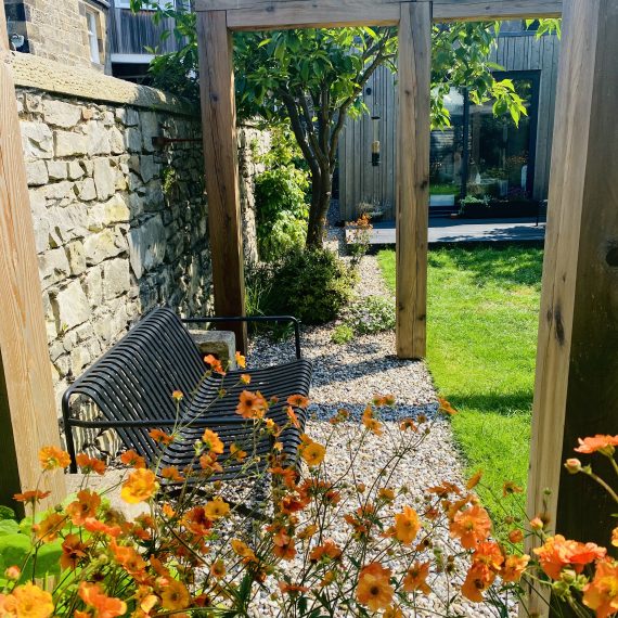 Scottish larch pergola and herbaceous planting