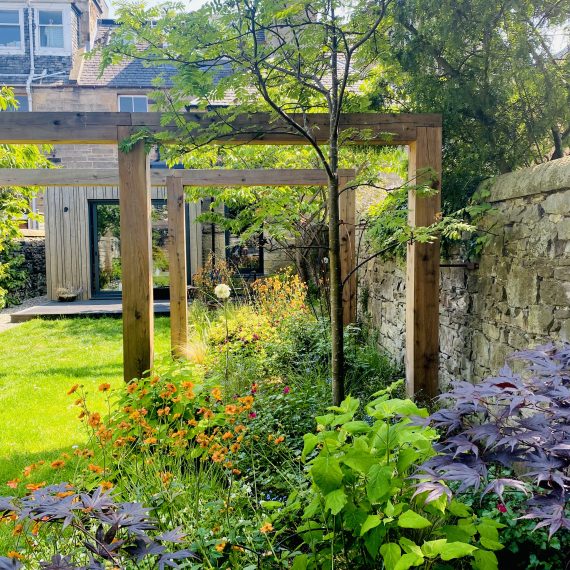 Scottish larch pergola and herbaceous planting