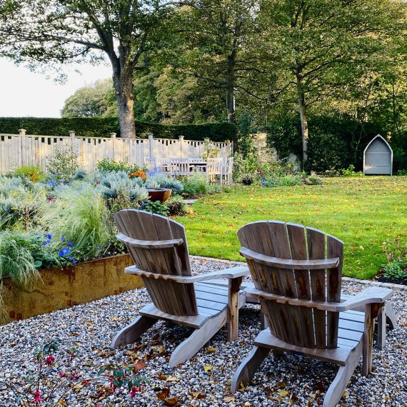 Adirondack chairs, garden design by Carolyn Grohmann