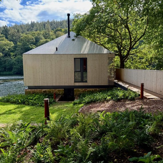 Bollard lighting and decked walkway in summer