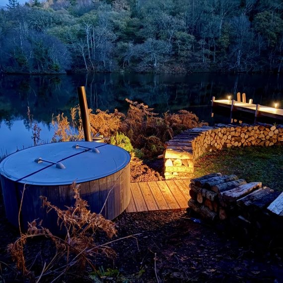 Hot tub and log wall lighting