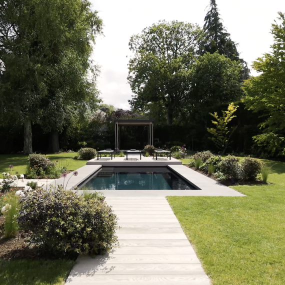 Outdoor swimming pool and pergola