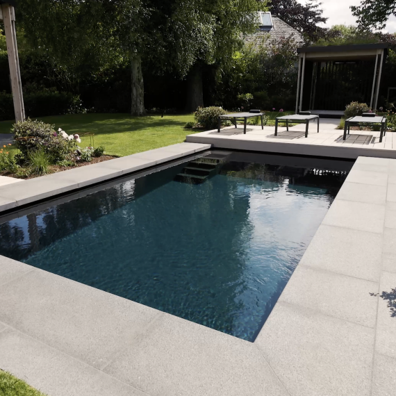 Outdoor swimming pool and pergola